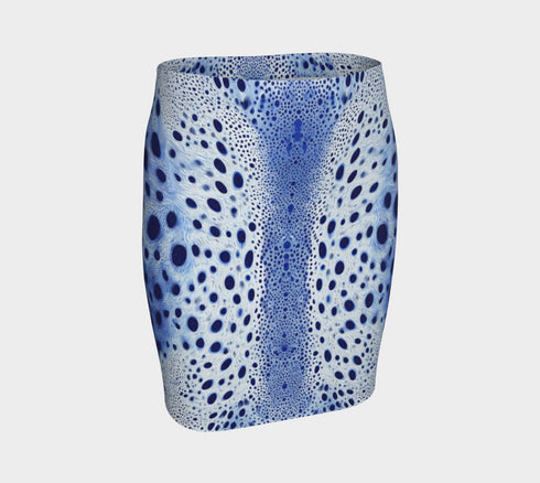 A high-waisted, bodycon mini skirt with a tight, fitted silhouette ending mid-thigh. The skirt features a vibrant, all-over graphic print inspired by a deer pelt. The pattern consists of a white and light blue textured base covered in irregular royal blue spots of varying sizes, creating a mesmerizing, psychedelic animal print effect. The skirt is made from a smooth, stretchy performance knit fabric with a subtle sheen, designed to hug the body's curves. The elastic waistband is seamless.